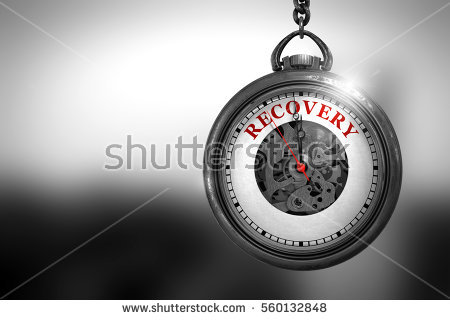 stock-photo-business-concept-recovery-on-watch-face-with-close-view-of-watch-mechanism-vintage-effect-560132848